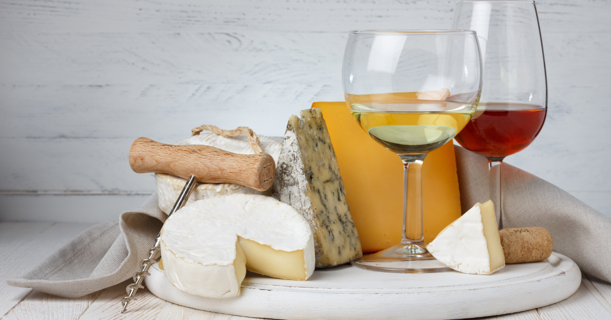 A beautifully arranged platter of wine and cheese, for Shavuot